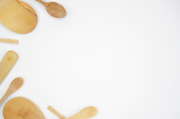 Flat lay frame with wooden spoons and copy-space