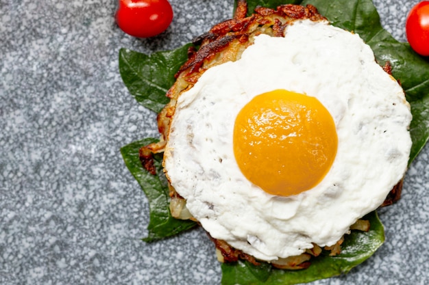Flat lay fried egg breakfast with tomatoes