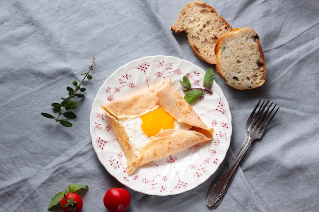 Flat lay fried eggs with crepes