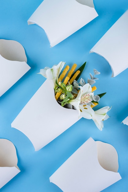 Flat lay fries with flowers and boxes