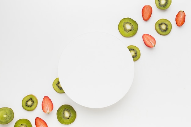 Flat lay of fruit assortement with plate