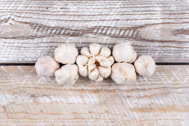 Flat lay garlic on wooden table