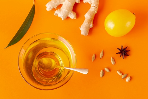 Flat lay ginger lemon and honey bowl with spoon