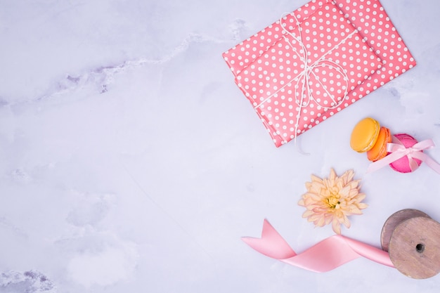 Flat lay girly birthday supplies on marble background