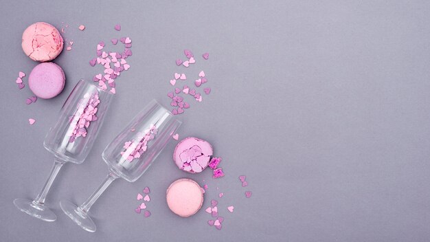 Flat lay of glasses with heart-shaped confetti