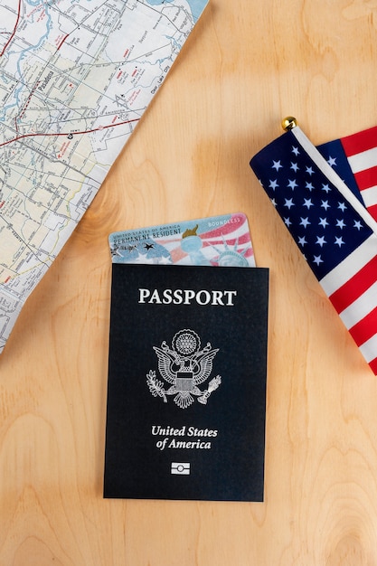 Flat lay green card and passport arrangement