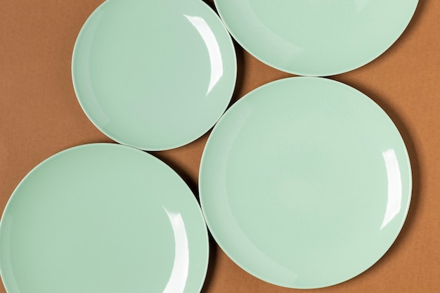 Free photo flat lay green plates assortment