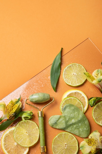 Flat lay gua sha and citrus arrangement