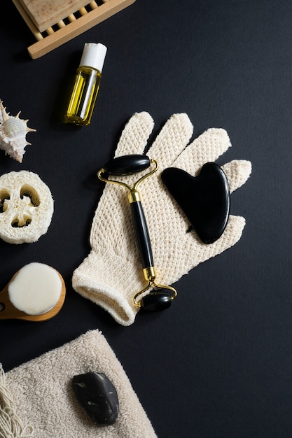 Flat lay gua sha and wooden items arrangement