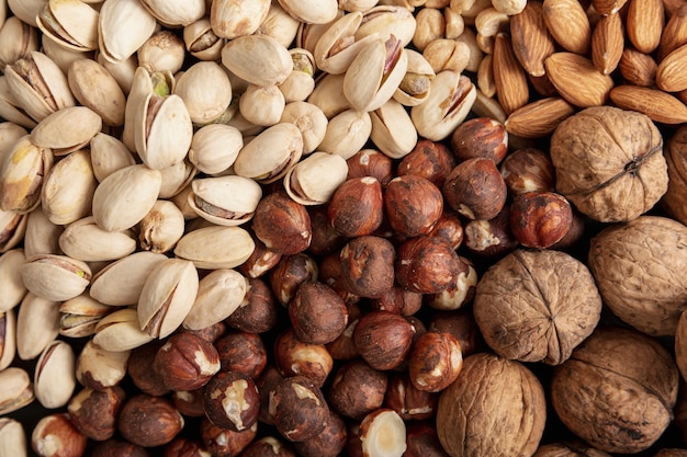 Flat lay of hazelnuts with almonds and pistachios