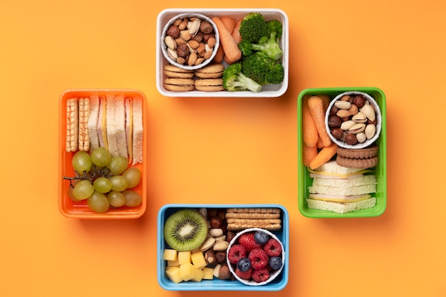 Free photo flat lay healthy food lunch boxes