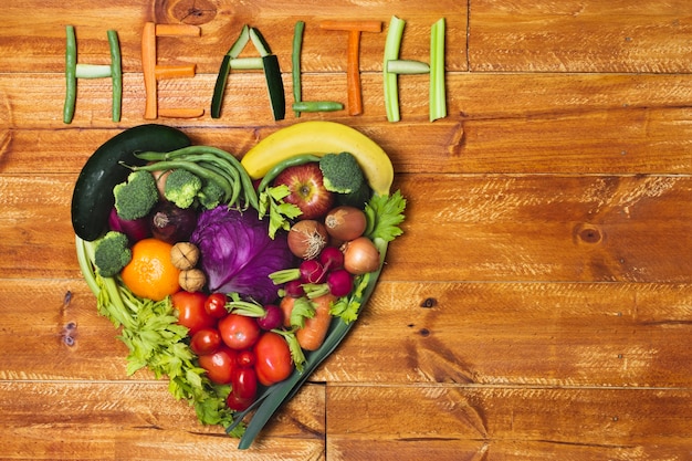 Flat lay heart shaped vegetable arrangement