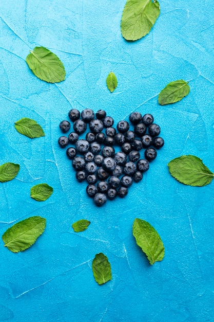 Flat-lay heartshaped currants with leaves