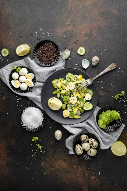 Flat lay homemade salad with dark tableware