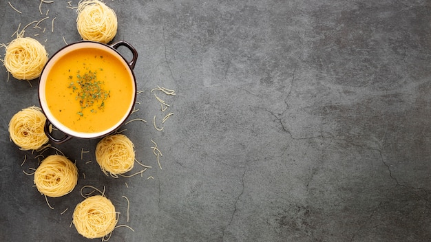 Flat lay homemade soup and pasta