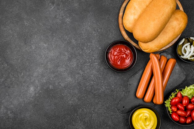 Flat lay hot dog ingredients with copy-space