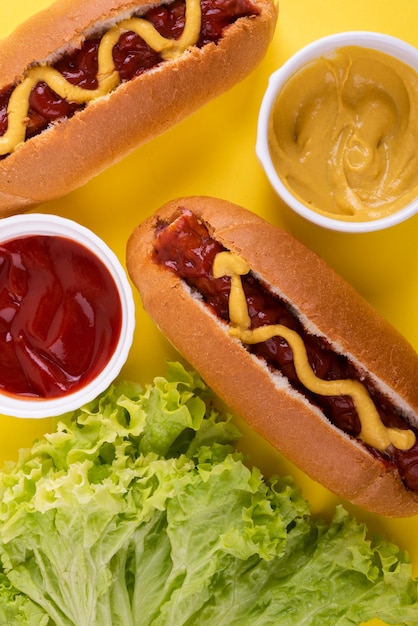 Free photo flat lay of hot dogs with ketchup and mustard