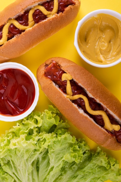 Flat lay of hot dogs with ketchup and mustard