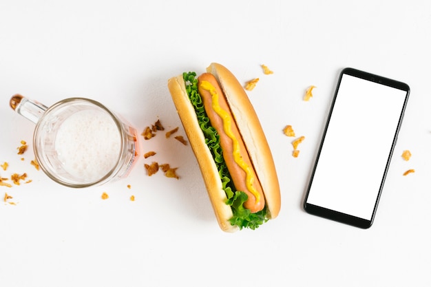 Flat lay hotdog with smartphone mock-up