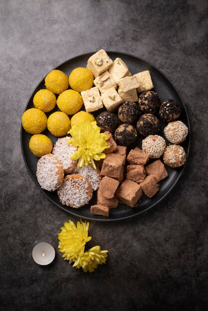 Flat lay indian dessert arrangement