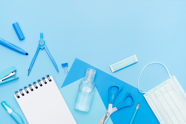 Flat lay items on blue background