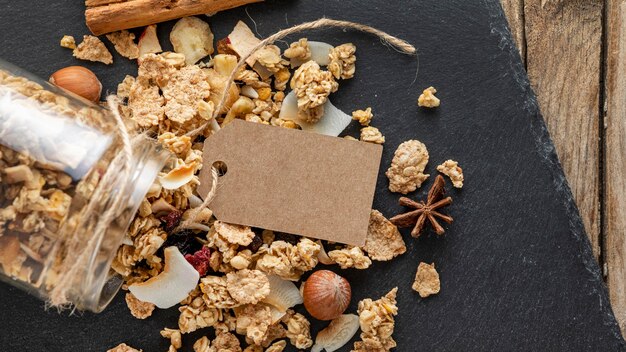 Flat lay of jars with breakfast cereals on slate