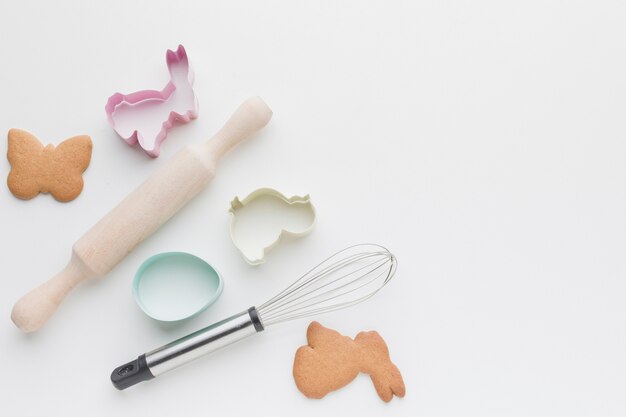 Flat lay of kitchen utensils and bunny shaped forms for cookies