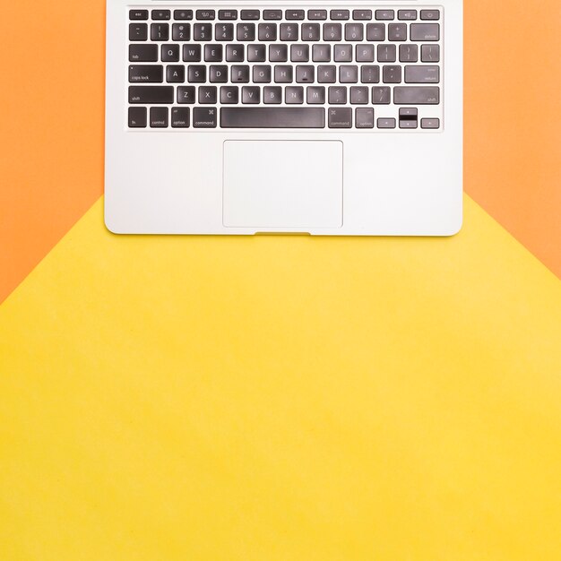 Flat lay laptop on colorful background