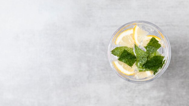 Flat lay of lemonade on wooden background with copy space
