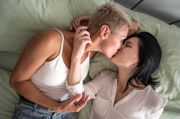 Free photo flat lay lesbian couple kissing