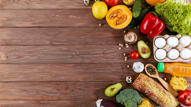 Flat lay of lots of vegetables with eggs and copy space