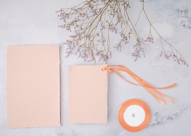 Flat lay lovely arrangement with wedding invitations mock-up