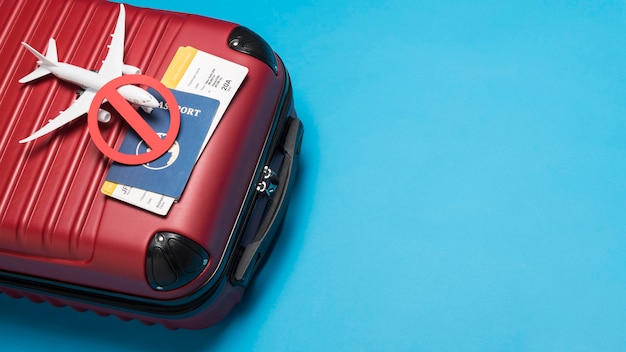 Flat lay luggage on blue background