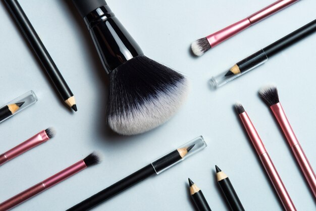 Flat lay makeup brushes arrangement