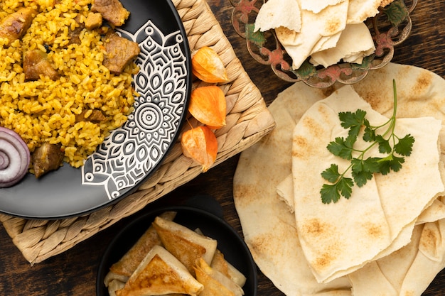 Flat lay meal with rice and pita