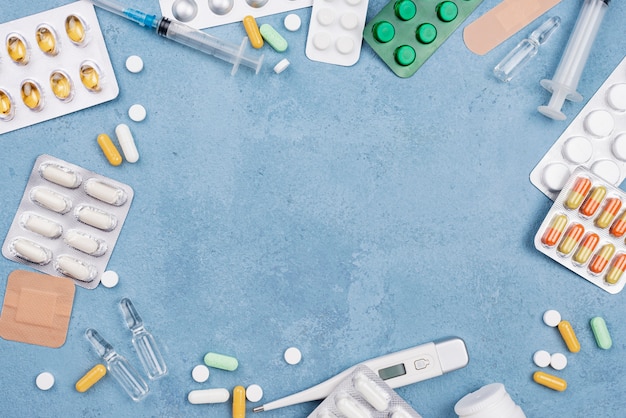 Flat lay medical elements composition on blue cement background