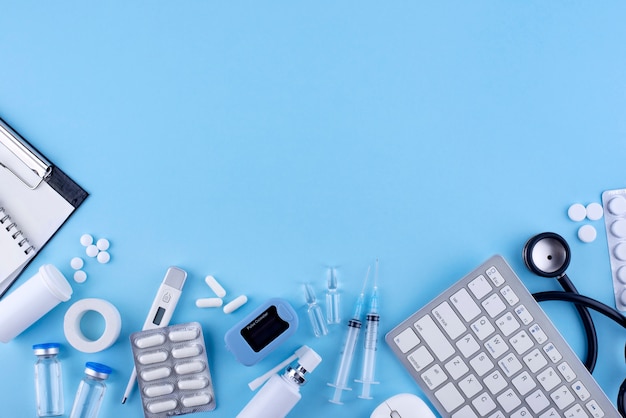 Flat lay medicine on blue background