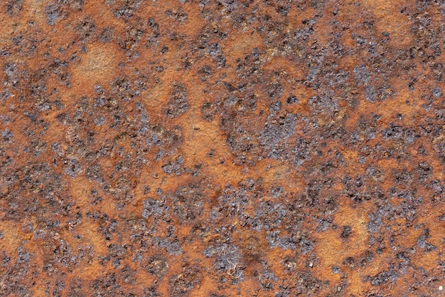 Flat lay of metal surface with rust