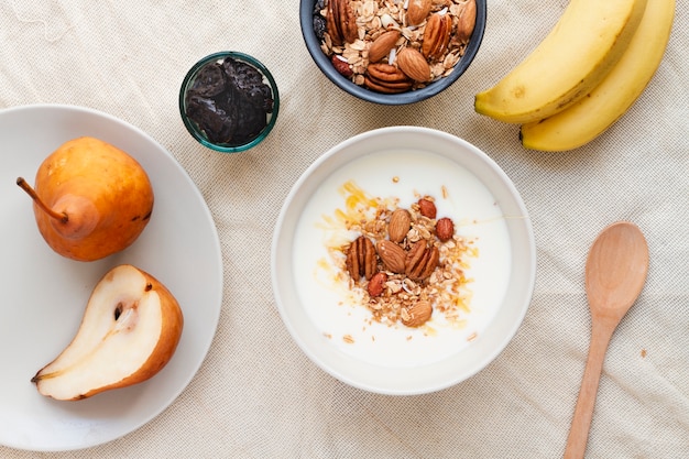 Flat lay milk with mix of nuts and pears