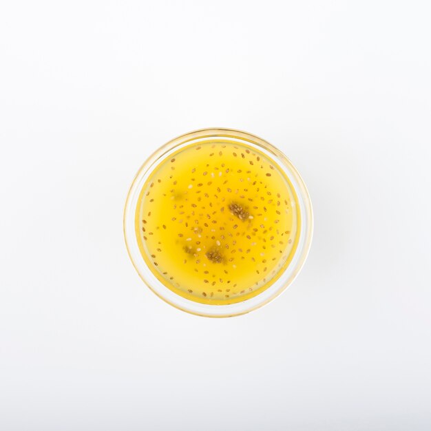 Flat lay minimalist glass with citrus juice
