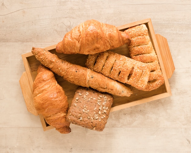 Free photo flat lay mix of pastry in wooden box