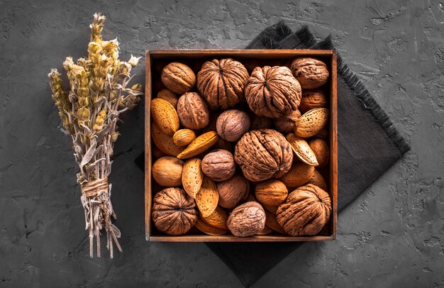 Flat lay mix of walnuts and seeds in box