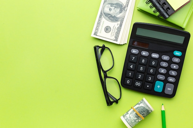 Flat lay money and calculator arrangement