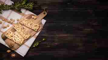 Free photo flat lay of muesli bar on wooden table