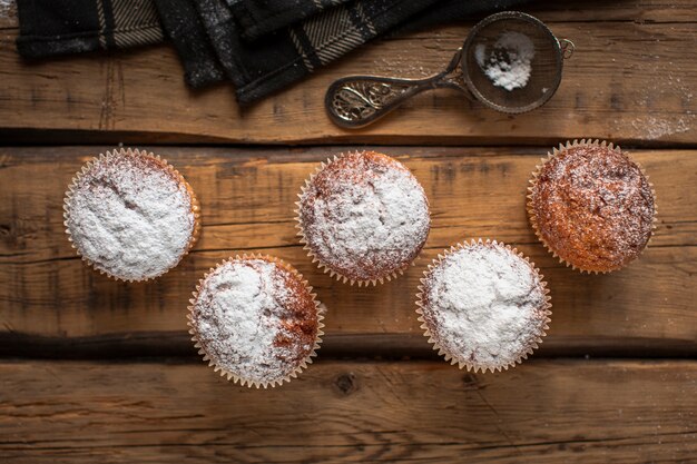 Flat lay muffins with powdered sugar