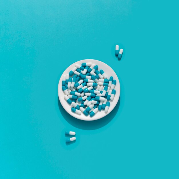 Flat lay of multiple pills on plate