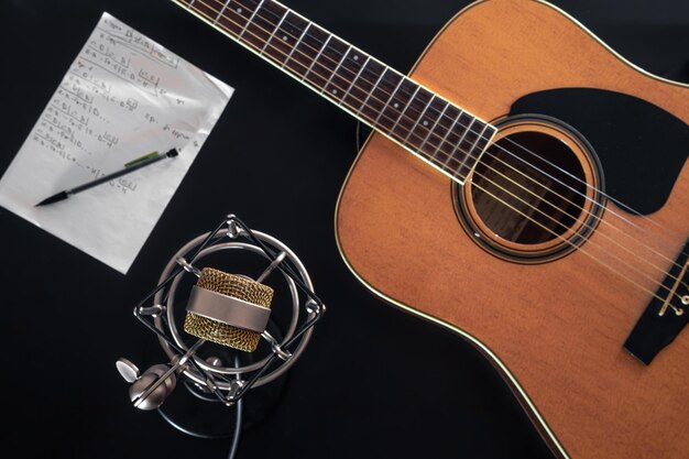 Flat lay music background with acoustic guitar