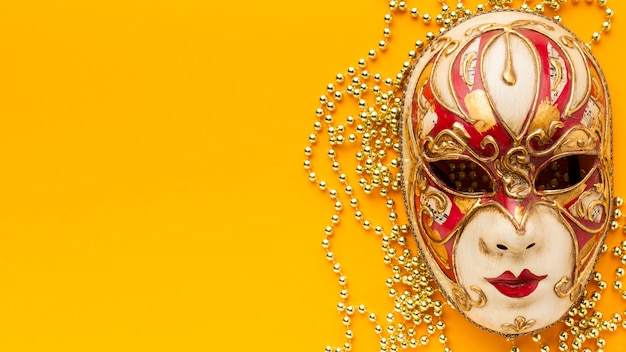 Flat lay mystery carnival elegant mask