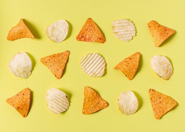 Flat lay of nacho chips with potato chips