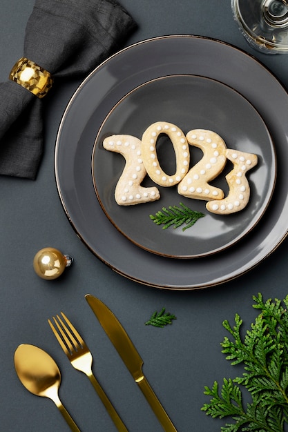 Free photo flat lay new year cookies on plate